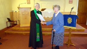 Sylvia Cook is presented with her 60 years Long Service Certificate